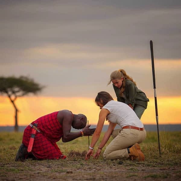 Maasai cultural experience — traditional warrior with red shuka in Kenya